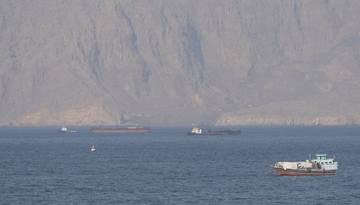 Ships and tankers in the Strait of Hormuz off the coast of Musandam, Oman, April 18, 2026. — Reuters