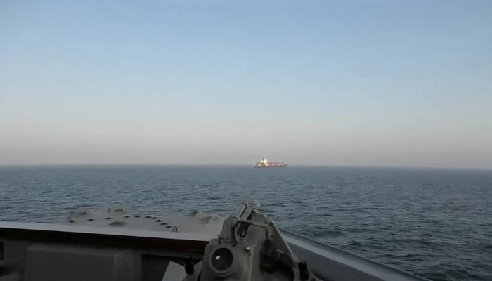 A view of Iranian-flagged cargo ship M/V Touska as the US Navy Arleigh Burke-class Aegis guided missile destroyer USS Spruance conducts its interception in a location given as the north Arabian Sea, in this screen capture from a video released April 19, 2026. — Reuters