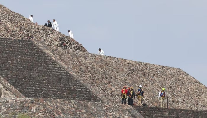 Mexican authorities work at the scene where a man shot dead a Canadian woman and injured several others before killing himself, Mexicos Security Cabinet says, according to preliminary information, at the Teotihuacan pyramids, a popular tourist and archaeological site on the outskirts of Mexico City, Mexico, April 20, 2026.— Reuters
