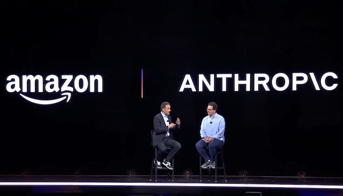 Screengrab shows Adam Selipsky, then CEO of Amazon Web Services, speaking with Anthropic CEO and co-founder Dario Amodei at a conference. — YouTube/@AWSEventsChannel