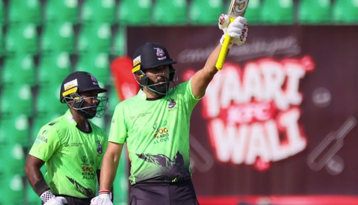 Lahore Qalandars opening batter Fakhar Zaman raises his bat after scoring a half-century during their Pakistan Super League (PSL) 11 match against Quetta Gladiators at Gaddafi Stadium in Lahore on April 21, 2026. — PSL