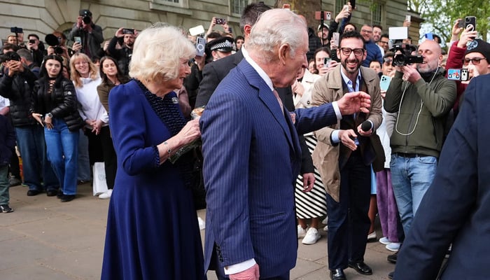 Britains King Charles and Queen Camilla greet crowds after visiting the Queen Elizabeth II: Her Life in Style exhibition at The Kings Gallery, Buckingham Palace, London, Britain April 20, 2026. — Reuters
