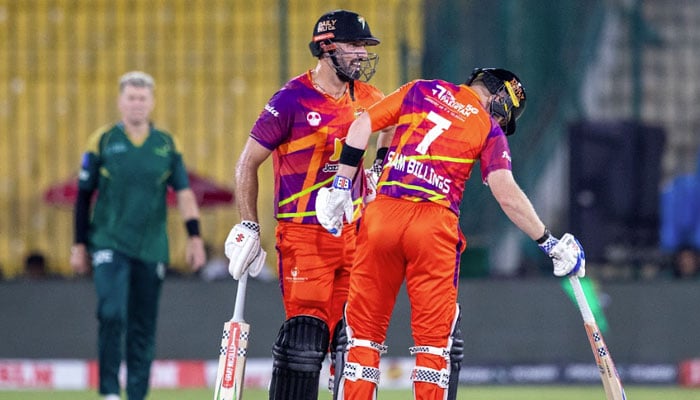Rawalpindiz batter Daryl Mitchell interacts with Sam Billings during the PSL 11 match against Multan Sultans at National Bank Stadium, Karachi, on April 21, 2026. — PSL