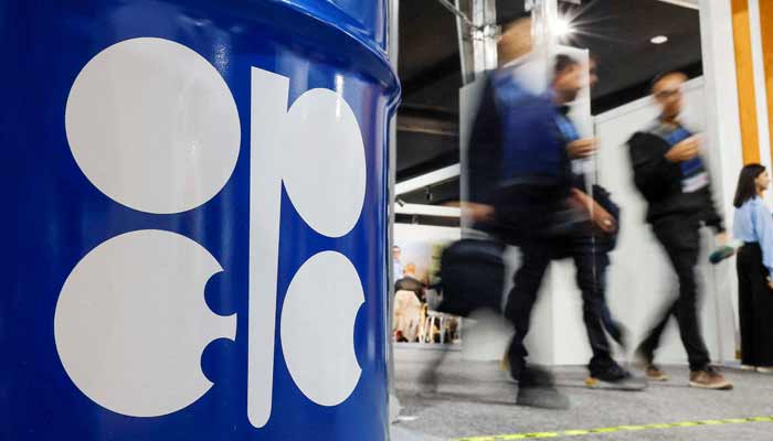 People walk past an installation depicting barrel of oil with the logo of Organisation of the Petroleum Exporting Countries (Opec) during the COP29 United Nations climate change conference in Baku, Azerbaijan. — Reuters/File