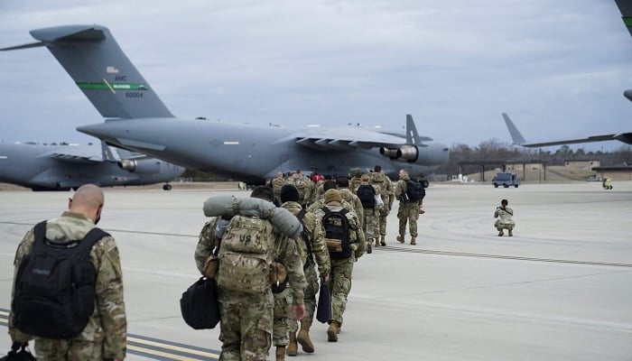 US military personnel board a C-17 transport plane for deployment. — Reuters/File