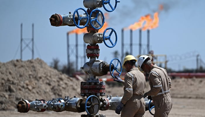 Employees of Basra Oil Company, work at the Nahr Bin Umar Oil and Gas Field on the outskirts of the southern Iraqi city of Basra on April 29, 2026. — AFP