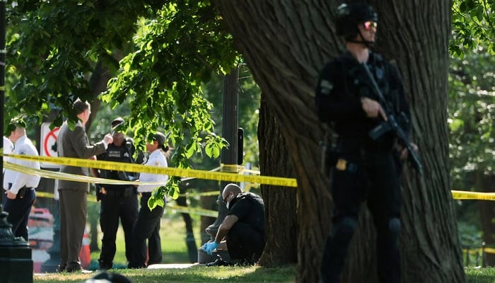 A US Secret Service crime scene investigator works at the scene of an officer-involved shooting in Washington, DC, US, May 4, 2026. — Reuters