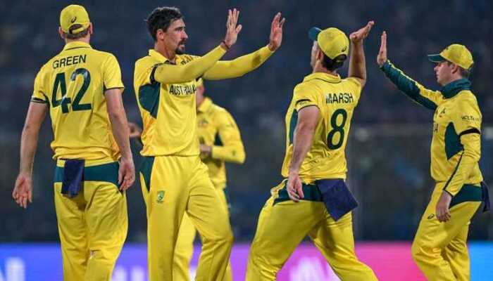 Australian cricketers celebrate after taking a wicket during a match in this undated photo. – AFP