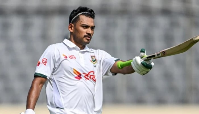 Bangladeshs captain Najmul Hossain Shanto celebrates after scoring a century during day one of the first test against Pakistan at the Sher-e-Bangla National Stadium in Mirpur on May 8, 2026. - AFP