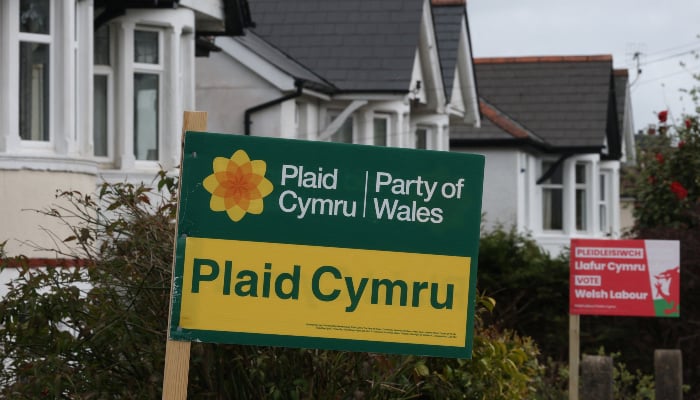 Signs in support of Welsh Labour and Plaid Cymru political parties are placed outside of houses, ahead of the upcoming Senedd (Welsh Parliament) devolved general election, in Caerphilly, south Wales, Britain, April 16, 2026. — Reuters