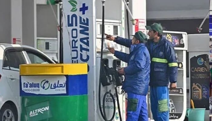 Employees at a fuel station attend to their customers in Islamabad on February 16, 2022. — AFP/File