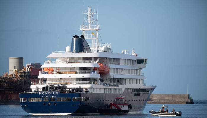 Boats approach the Dutch flagged hantavirus-stricken cruise ship MV Hondius after it arrived at the industrial port of Granadilla de Abona on the island of Tenerife in Spain´s Canary Islands on May 10, 2026. — AFP