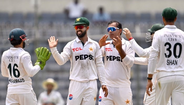 Pakistani players celebrate after taking the wicket of Bangladeshs captain Najmul Hossain Shanto during the fifth day of the first Test cricket match between Bangladesh and Pakistan at the Sher-e-Bangla National Stadium in Mirpur on May 12, 2026. — AFP