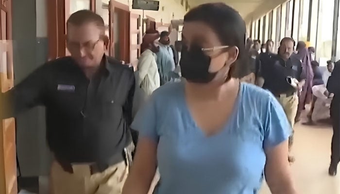 Police produce alleged drug peddler Anmol alias Pinky before a local court in Karachi on May 12, 2026. — YouTube/Geo News/screengrab
