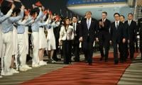 Trump arrives in China for superpower summit with Xi
