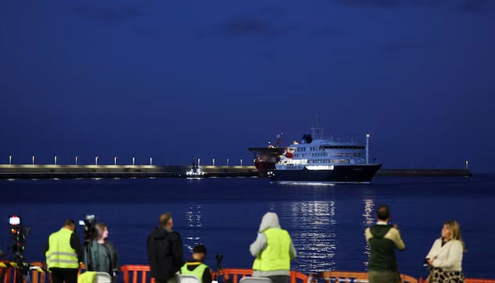 Members of the media work at the port of Granadilla de Abona following the arrival of the cruise ship MV Hondius, affected by a hantavirus outbreak, in Tenerife, Spain, May 11, 2026. — Reuters