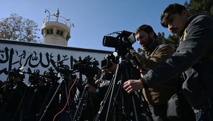 This representational image shows cameramen from different media houses covering an event. — AFP/File