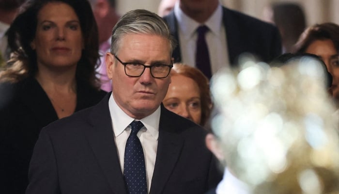 Britain´s Prime Minister Keir Starmer (centre) returns to the House of Commons after listening to the kings speech during the State Opening of Parliament at the Palace of Westminster in London on May 13, 2026. — AFP