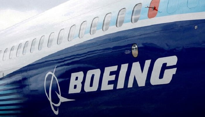 The Boeing logo is seen on the side of a Boeing 737 MAX at the Farnborough International Airshow, in Farnborough, Britain, July 20, 2022. — Reuters