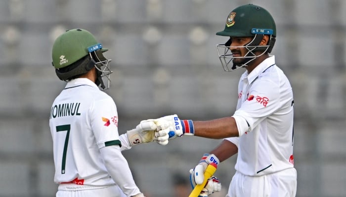 Bangladeshs Mahmudul Hasan Joy (right) and Mominul Haque bump fists during the second day of the second Test against Pakistan at the Sylhet International Cricket Stadium, Sylhet May 17, 2026. — AFP