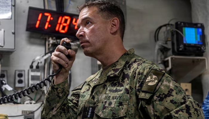 US Navy Admiral Brad Cooper, commander of US Central Command, makes an announcement aboard Nimitz-class aircraft carrier USS Abraham Lincoln in the Arabian Sea February 7, 2026. — Reuters