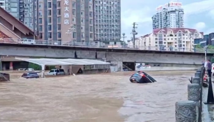 Cars partially submerged in floodwaters after heavy rainfall in Duyun, Guizhou Province, China, May 19, 2026, in this still image obtained from a social media video. — Reuters