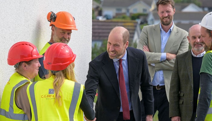 Britains Prince William, Prince of Wales, speaks with staff during his visit to Nansledan, a sustainable community development led and managed by the Duchy of Cornwall, in the suburbs of Newquay, England, on May 21, 2026. — Reuters