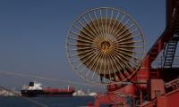 Oil whipsaws, Asian markets climb on US-Iran peace hopes