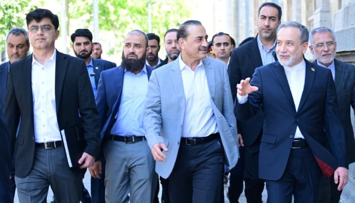 COAS-CDF Field Marshal Asim Munir (centre) and Irans Foreign Minister Abbas Araghchi (right) interact in Tehran, May 23, 2026. — ISPR