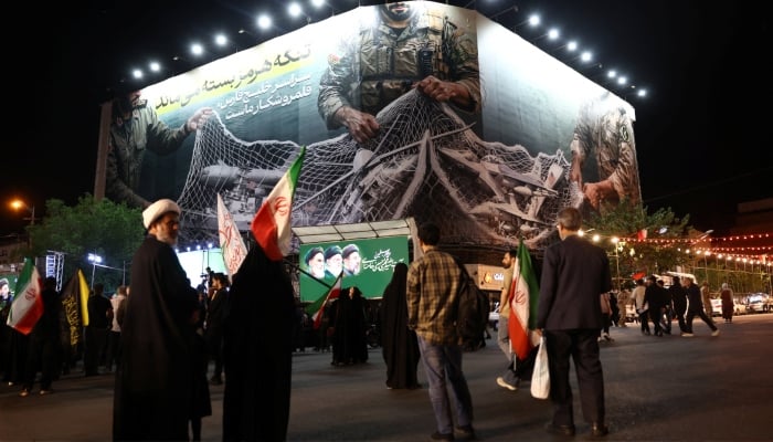 A billboard with a graphic design about the Strait of Hormuz on a building in Tehran, Iran, May 6, 2026. — Reuters