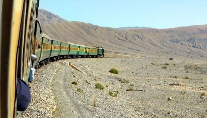 An undated image of a Pakistan Railways passenger train passing through a mountainous terrain in Balochistan. — Pakistan Railways