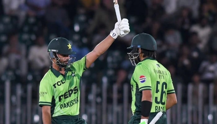 Pakistans Ghazi Ghori (left) celebrates scoring half-century with teammate Babar Azam during their first ODI against Australia at the Rawalpindi Cricket Stadium in Rawalpindi on May 30, 2026. — PCB
