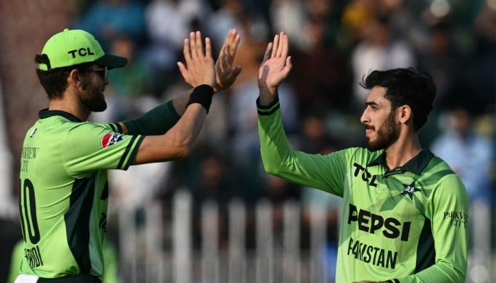 Pakistans Arafat Minhas (right) celebrates a wicket with captain Shaheen Afridi during the first ODI against Australia series in Rawalpindi, May 30, 2026. — PCB