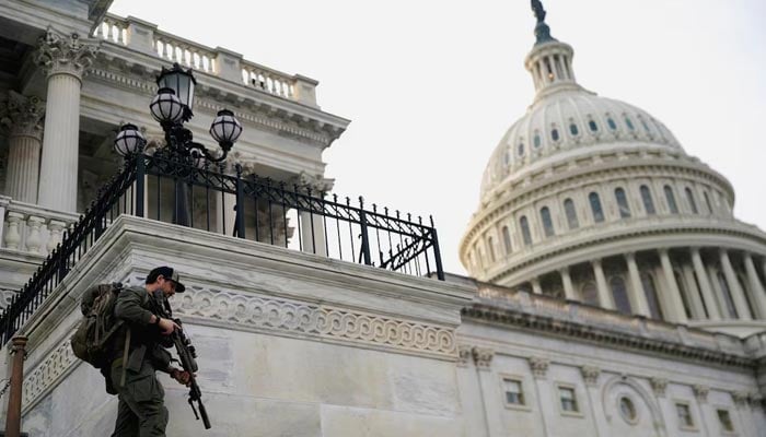 A member of the US Capitol police patrols following a vote in the US House of Representatives on a bipartisan war powers resolution aiming to stop the military campaign against Iran, on Capitol Hill, in Washington, DC, US, March 5, 2026. — Reuters
