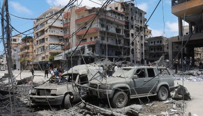 People gather at the site of an Israeli strike carried out last week, in Tyre, Lebanon, June 2, 2026. — Reuters