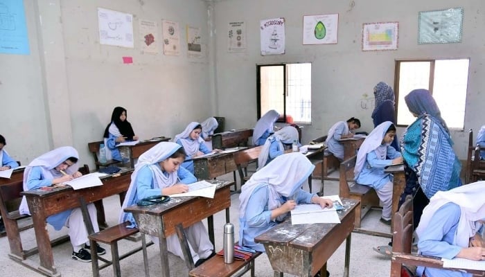 Students solving papers in the examination centre during the annual examination of matriculation under the Board of Intermediate and Secondary Education (BISE), located in the North Nazimabad area in Karachi, April 16, 2025. — PPI