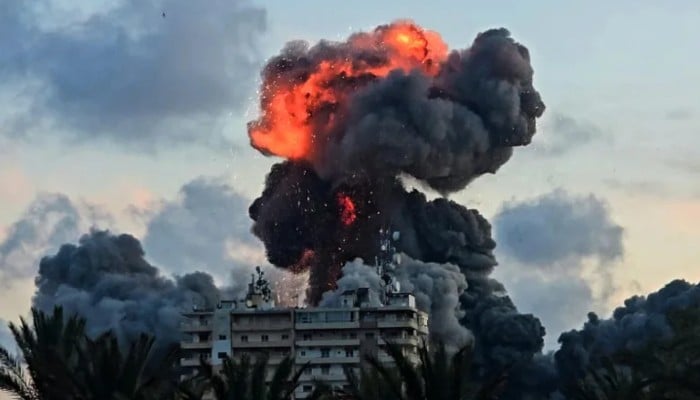 A fireball and smoke erupt from a building following an Israeli strike in Tyre, southern Lebanon, on 28 May 2026. — AFP