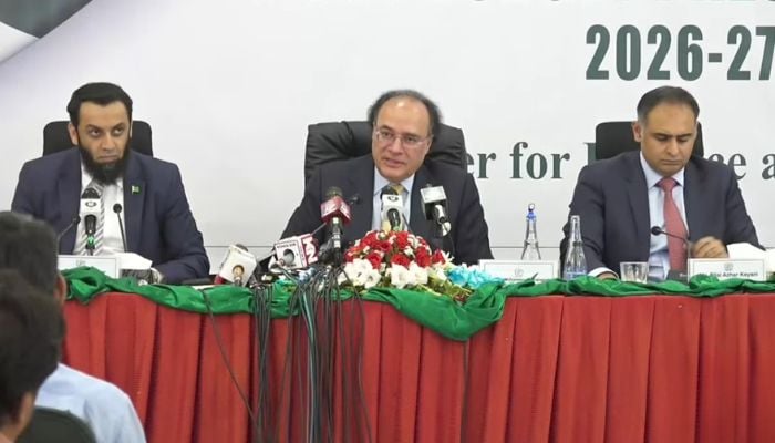 Finance Minister Muhammad Aurangzeb, along with Information Minister Attaullah Tarar (left) and Minister of State on Finance Bilal Azhar Kayani (right), addresses a post-budget press briefing in Islamabad, Pakistan, June 13, 2026. — Screengrab via YouTube/Geo News
