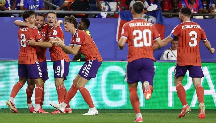 Scotlands midfielder #07 John McGinn (2nd L) celebrates with teammates after scoring his teams first goal during the 2026 World Cup Group C football match between Haiti and Scotland at the Boston Stadium in Foxborough on June 13, 2026. — AFP