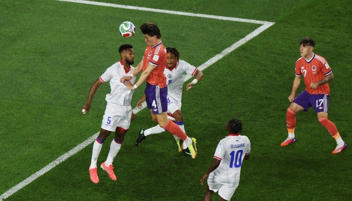 Scott McTominay #4 of Scotland heads the ball to the goal during the FIFA World Cup 2026 Group C match between Haiti and Scotland at Boston Stadium on June 13, 2026, in Foxborough, Massachusetts, US. — AFP