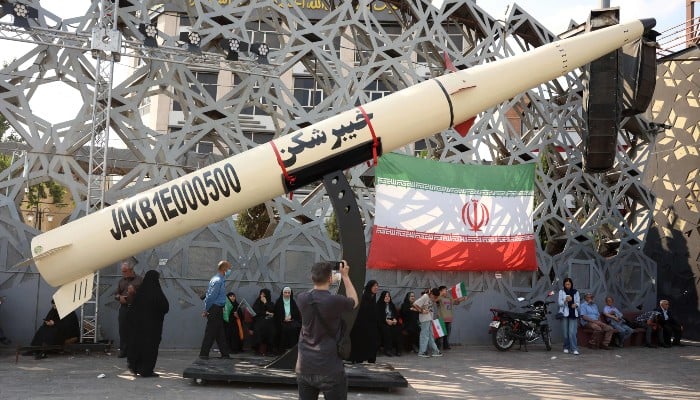 Iranians stand next to a symbol of a Kheibar missile as they take part during a rally in support of the countrys supreme leader Mojtaba Khamenei and commemorate Eid al-Ghadir in Tehran on June 4, 2026. — AFP