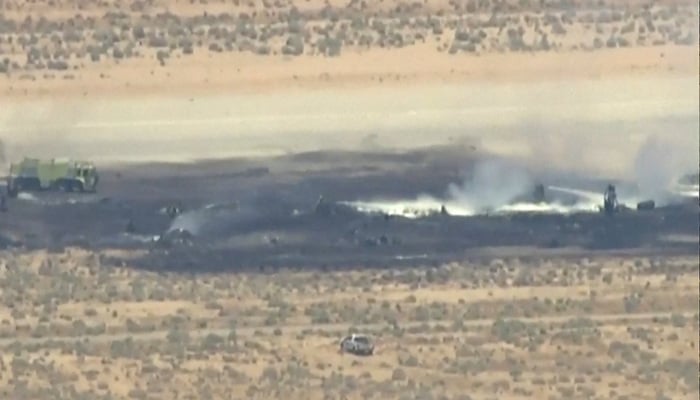 Smoke rises from a blackened part of Edwards Air Force Base after the crash of a US Air Force B-52 bomber aircraft in Edwards, California, US, June 15, 2026, in a still image from news helicopter video. — AFP
