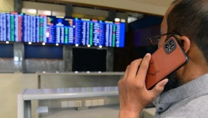 Broker is busy in trading at the Pakistan Stock Exchange in Karachi on Wednesday, January 1, 2025. — PPI