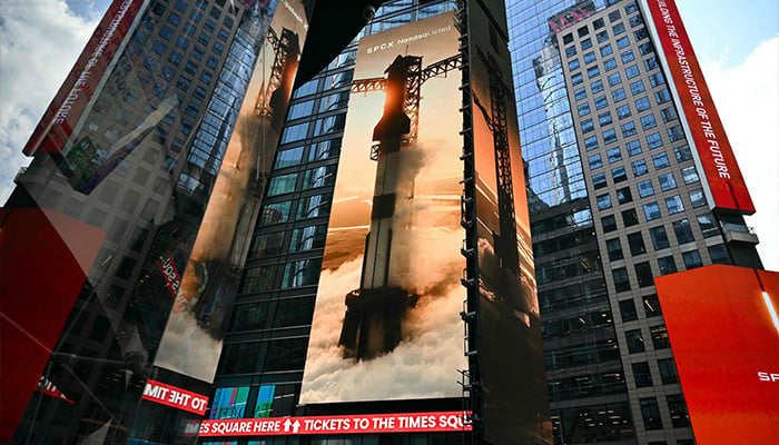 Images of SpaceX rockets are displayed on screens in Times Square near the Nasdaq MarketSite after the launch of SpaceXs initial public offering (IPO) in New York on June 12, 2026. — AFP