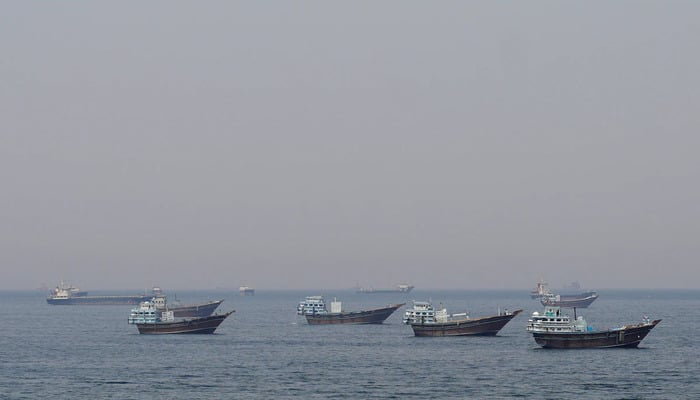 Ships and boats in the Strait of Hormuz off the coast of Musandam, Oman, April 20, 2026. — Reuters