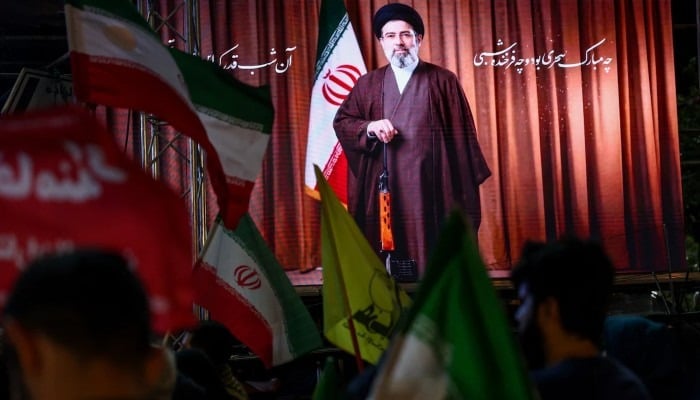A screen displays an image of Irans Supreme Leader Mojtaba Khamenei during a rally in Tehran, Iran, May 29, 2026. — Reuters