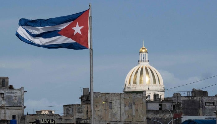 The Cuban flag flutters along the Malecon in Havana, with the Capitol seen in the background, on June 17, 2026. — AFP