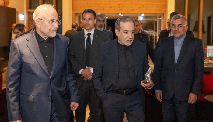 Minister of Foreign Affairs of Iran, Seyyed Abbas Araghchi, centre, and Speaker of the Islamic Parliament of Iran, Mohammad Bagher Ghalibaf, left, at the Buergenstock resort in Obbuergen, near Lucerne, Switzerland, Sunday, June 20, 2026. — Reuters