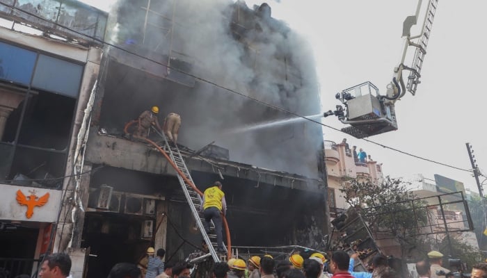 Firefighters try to douse a fire that broke out at a coaching institute in Lucknow on June 22, 2026. — AFP