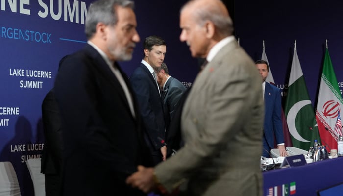 Prime Minister Shehbaz Sharif welcomes Irans Foreign Minister Abbas Araqchi, as US Vice President JD Vance, US delegation members stand in the background, before the start of a quadrilateral meeting between the US Iran, Pakistan, and Qatar at the Lake Lucerne Summit, aimed at advancing a deal to end the Middle East conflict, at Buergenstock Resort Lake Lucerne, near Stansstad, Switzerland, June 21, 2026. — Reuters